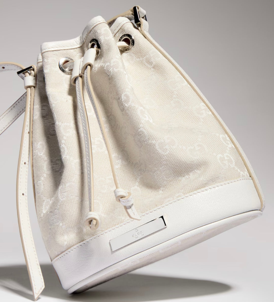 GUCCI MINI BUCKET BAG IN GG PLAQUE