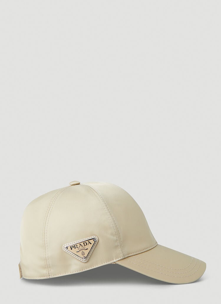 PRADA LOGO BADGE BASEBALL CAP IN BEIGE